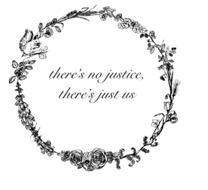Blumenkranz mit einer Phrase in der Mitte/ Wreath of flowers with the following words in the center: "There's no justice, there's just us"